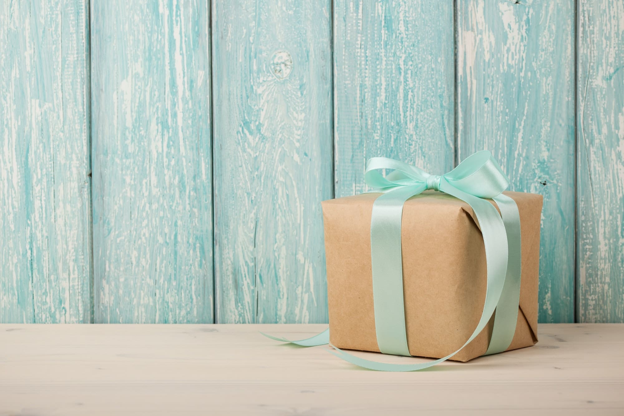 Gift box on wooden table